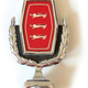 Illustration for article titled This Is Why Many Old Fords Had Badges With Three Cats On Them